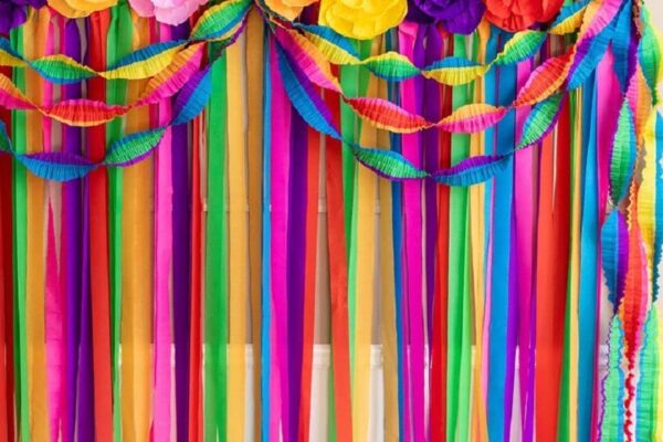 cinco-de-mayo-fiesta-paper-flowers-and-streamers-in-bright-colors-hanging-as-party-decor